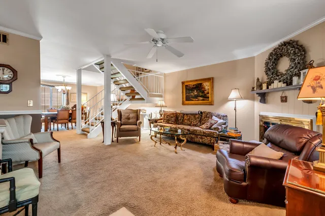 a living room with furniture and a clock