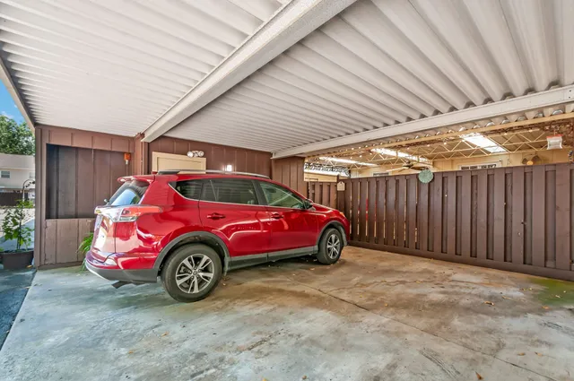 a view of pool with lawn chairs and a big yard