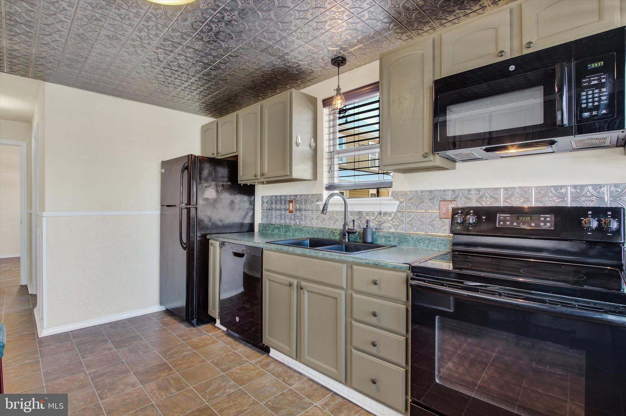 564 Blooming Grove Road Hanover, PA 17331 - Photo 12 of 27 a kitchen with stainless steel appliances a stove microwave and refrigerator