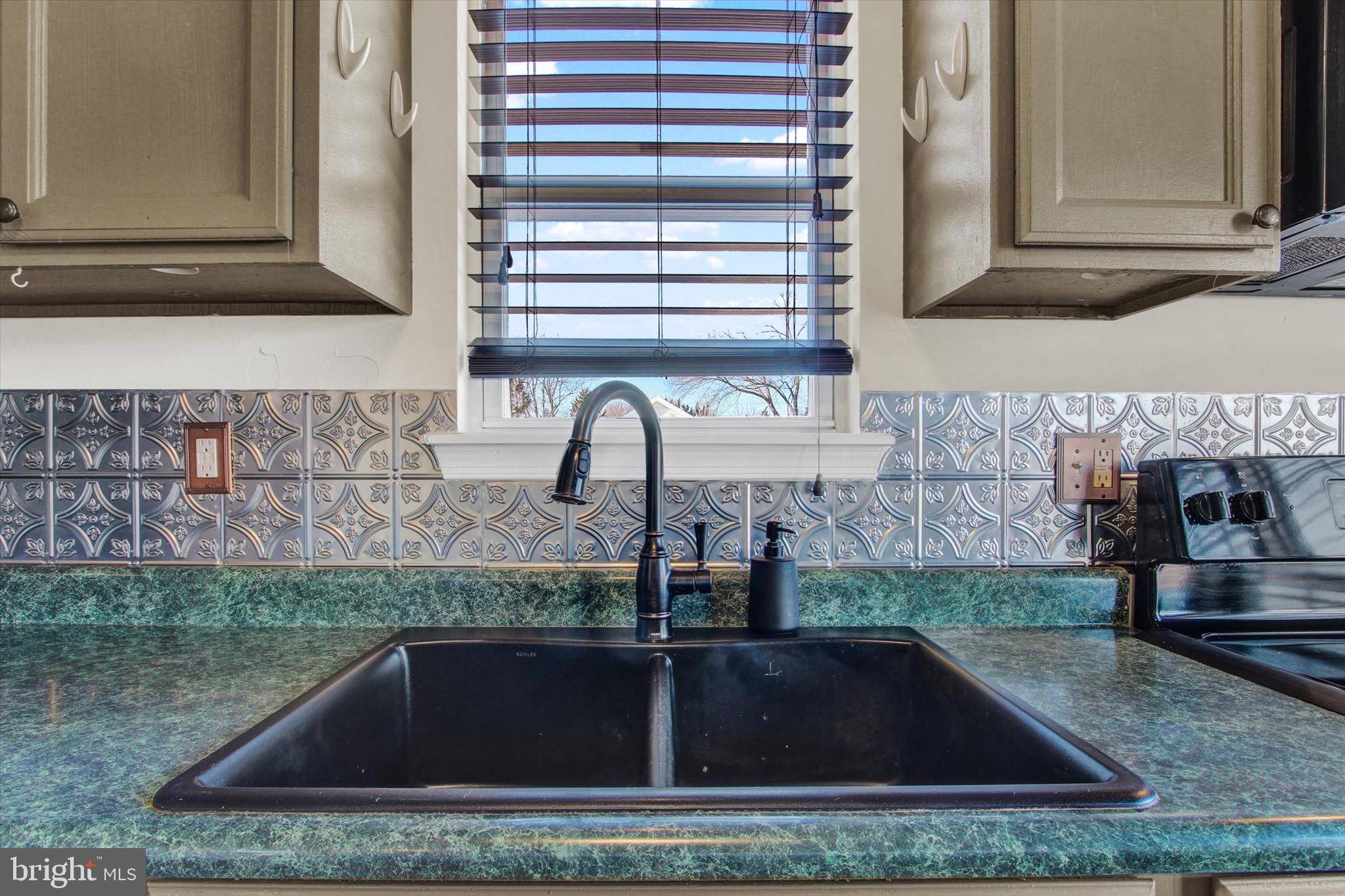 564 Blooming Grove Road Hanover, PA 17331 - Photo 13 of 27 a kitchen sink with granite countertop a sink and a stove
