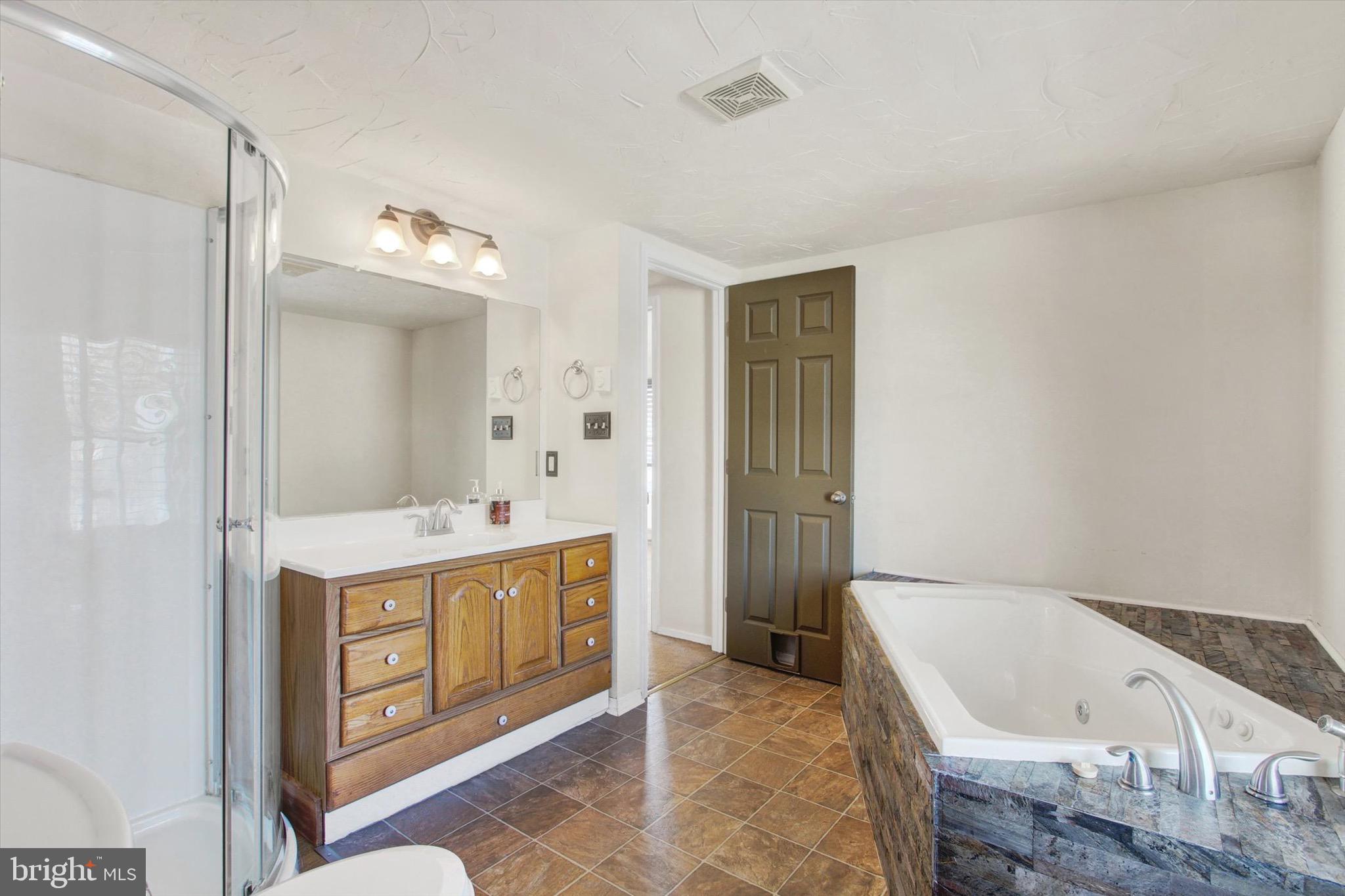 564 Blooming Grove Road Hanover, PA 17331 - Photo 20 of 27 a bathroom with a tub sink and mirror