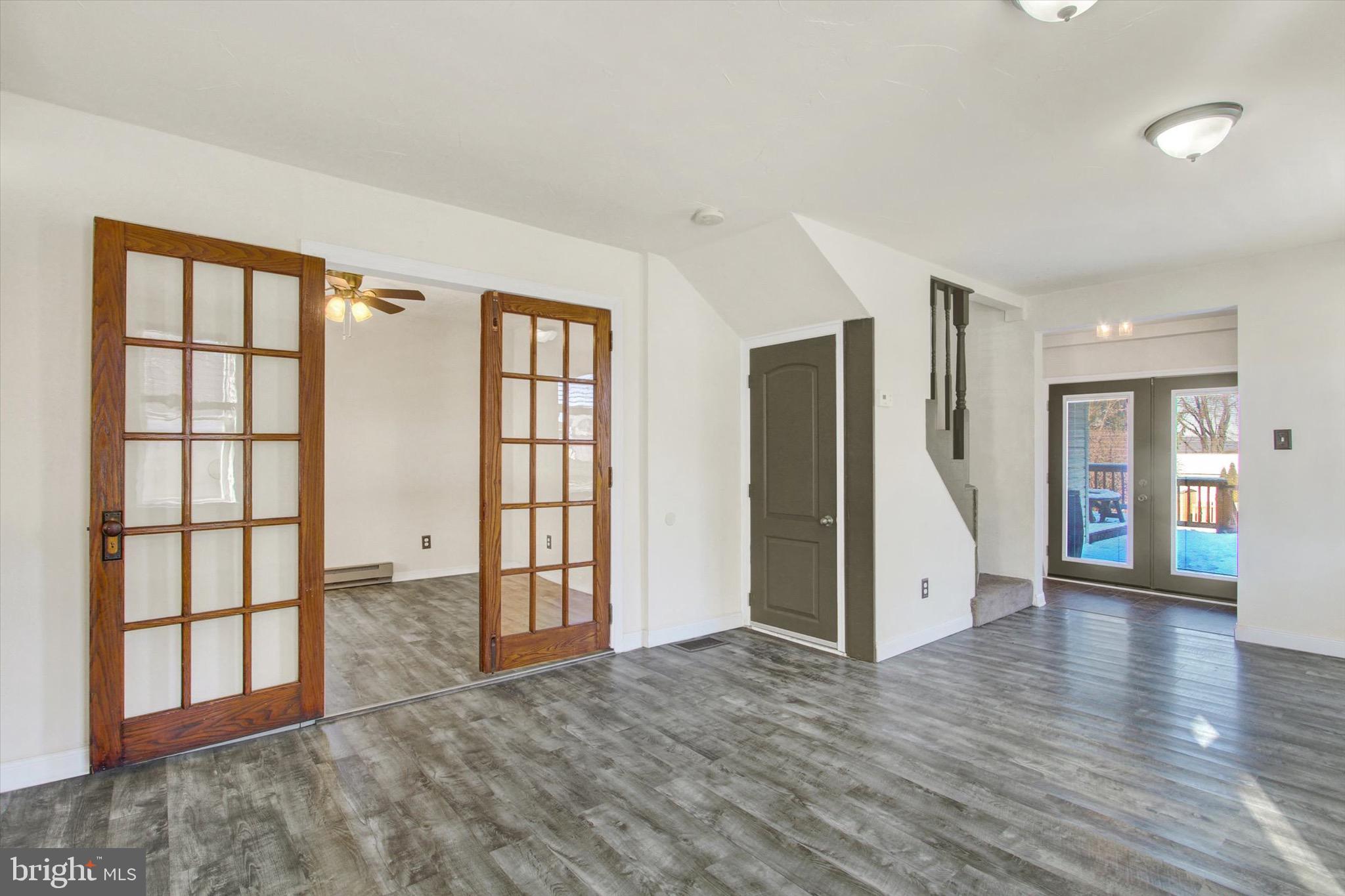 564 Blooming Grove Road Hanover, PA 17331 - Photo 6 of 27 an empty room with wooden floor and windows