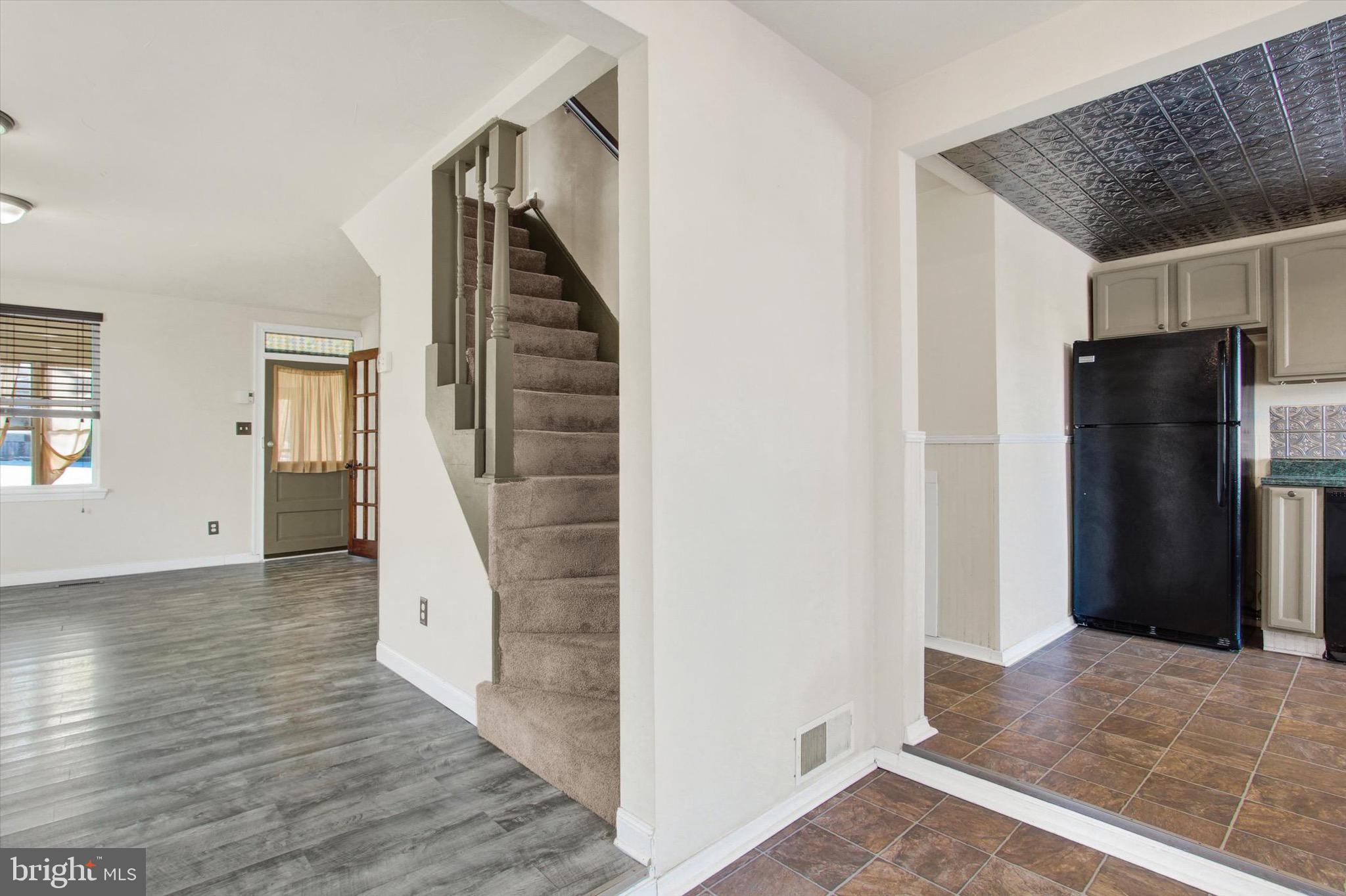 564 Blooming Grove Road Hanover, PA 17331 - Photo 9 of 27 a view of a livingroom with wooden floor and stairs