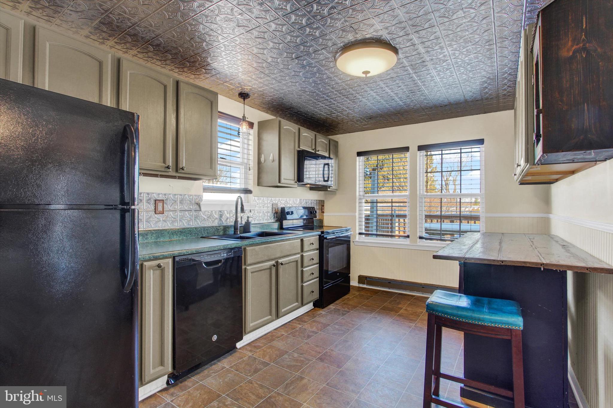 564 Blooming Grove Road Hanover, PA 17331 - Photo 10 of 27 a kitchen with stainless steel appliances granite countertop a sink stove and refrigerator