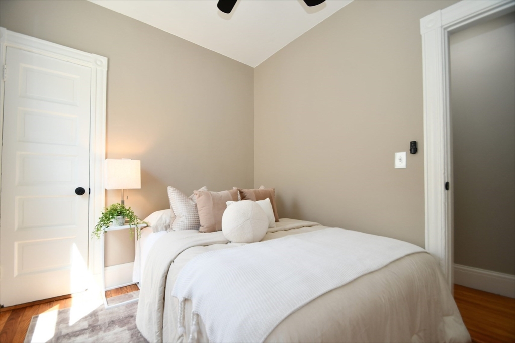 18 Lyon Street, Unit 2 Boston, MA 02122 - Photo 11 of 23 a bedroom with a bed and a window