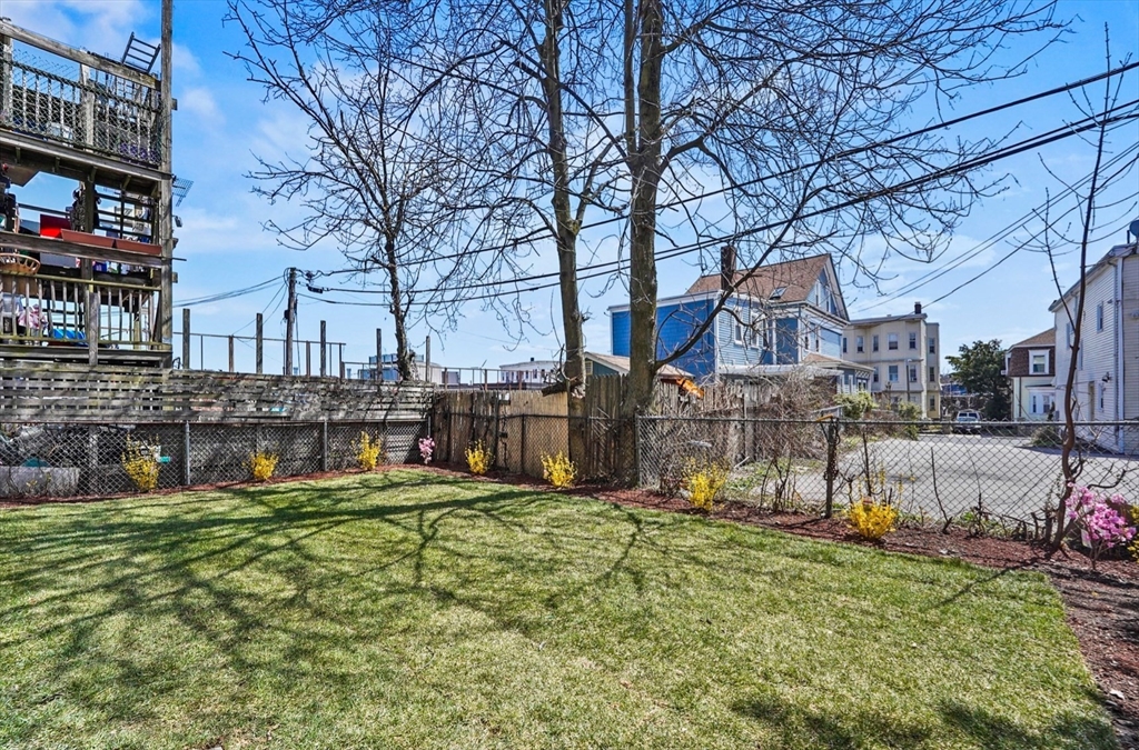 18 Lyon Street, Unit 2 Boston, MA 02122 - Photo 20 of 23 a view of a chairs and tables in the patio