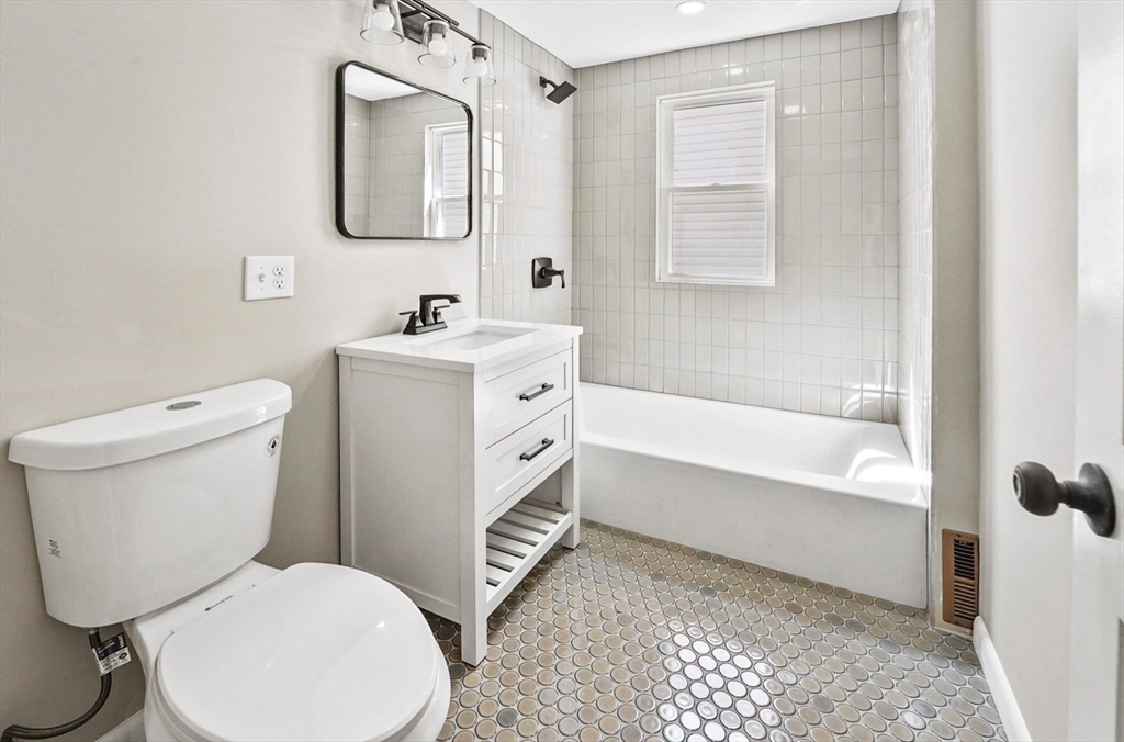 18 Lyon Street, Unit 2 Boston, MA 02122 - Photo 6 of 23 a bathroom with a toilet a sink and bathtub
