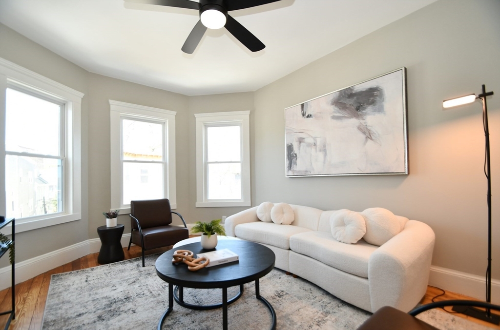 18 Lyon Street, Unit 2 Boston, MA 02122 - Photo 8 of 23 a living room with furniture and a large window