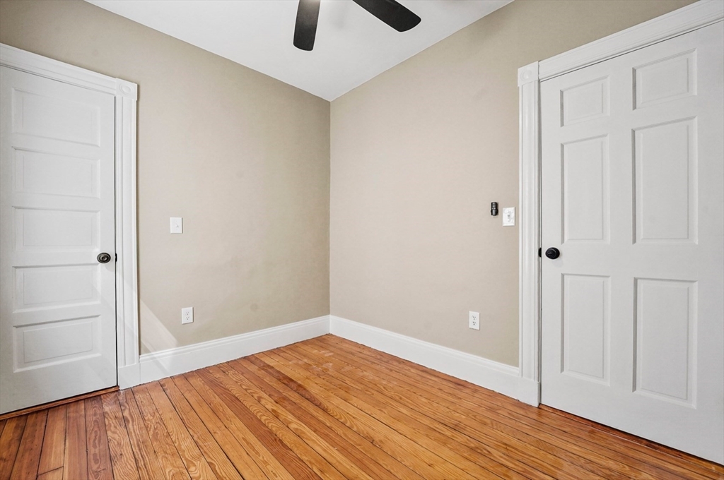 18 Lyon Street, Unit 2 Boston, MA 02122 - Photo 10 of 23 wooden floor in an empty room