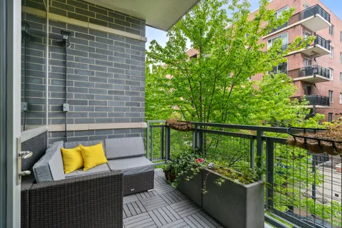 a view of balcony with furniture