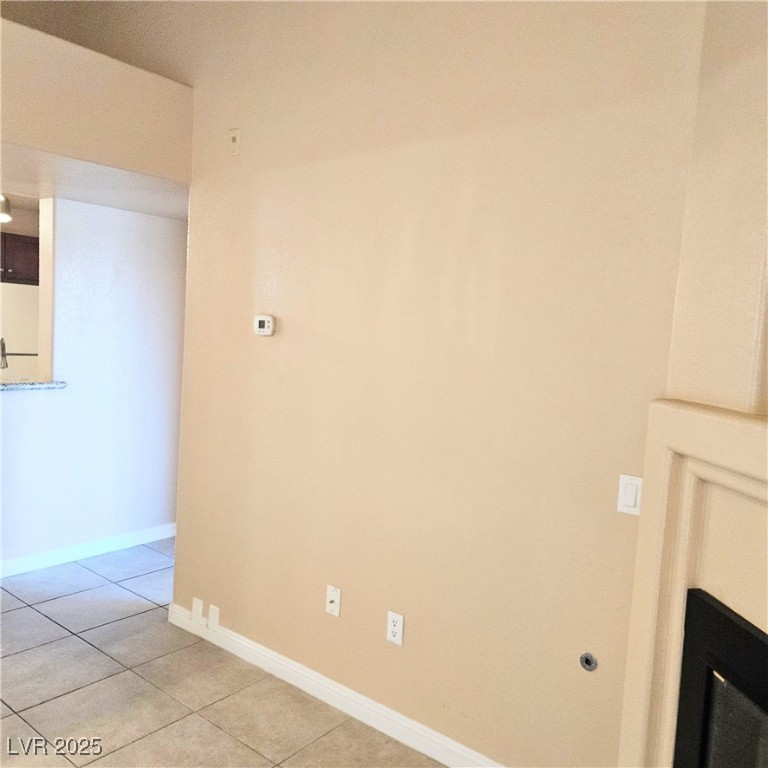 2120 Ramrod Avenue, Unit 1226 Henderson, NV 89014 - Photo 12 of 53 Unfurnished room with baseboards and light tile patterned floors