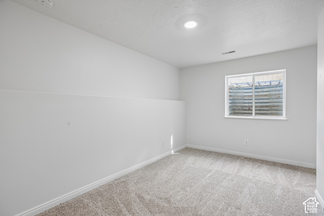 190 North 100 West Alpine, UT 84004 - Photo 9 of 31 Recessed ceiling lighting, light neutral paint, window with window well, light-toned carpeting