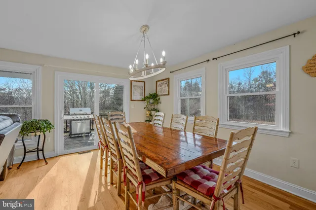 a kitchen with a sink a counter top space stainless steel appliances and cabinets