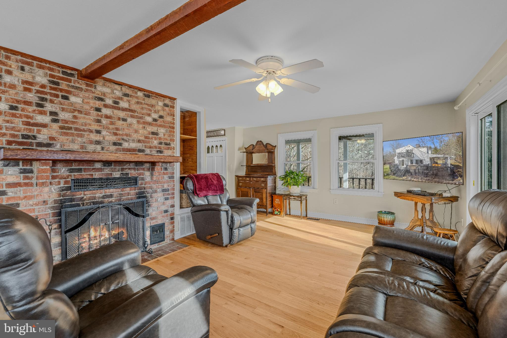 654 Soper Lane Berkeley Springs, WV 25411 - Photo 21 of 71 a living room with furniture and a fireplace