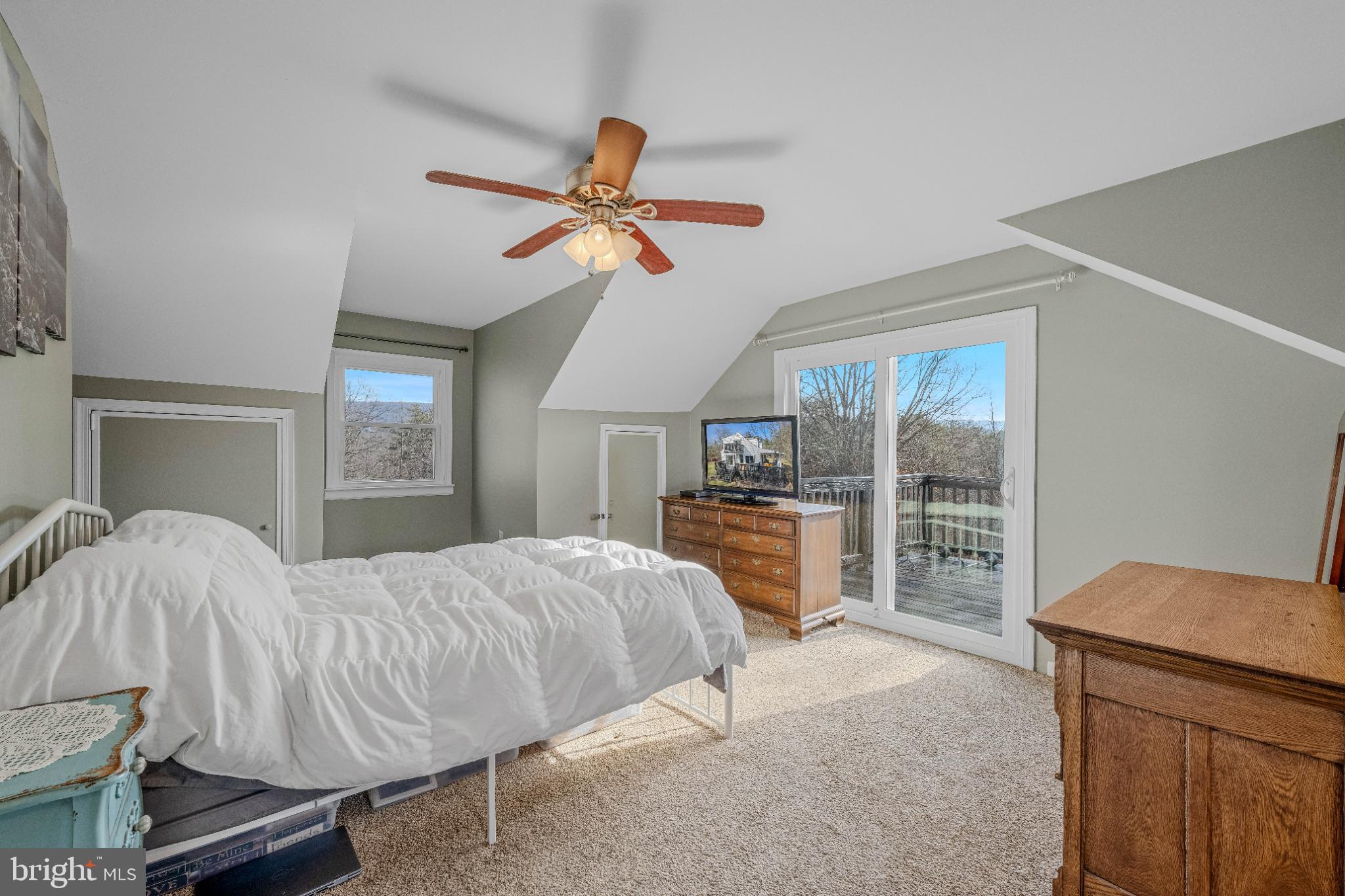 654 Soper Lane Berkeley Springs, WV 25411 - Photo 26 of 71 a bedroom with a bed and a dresser
