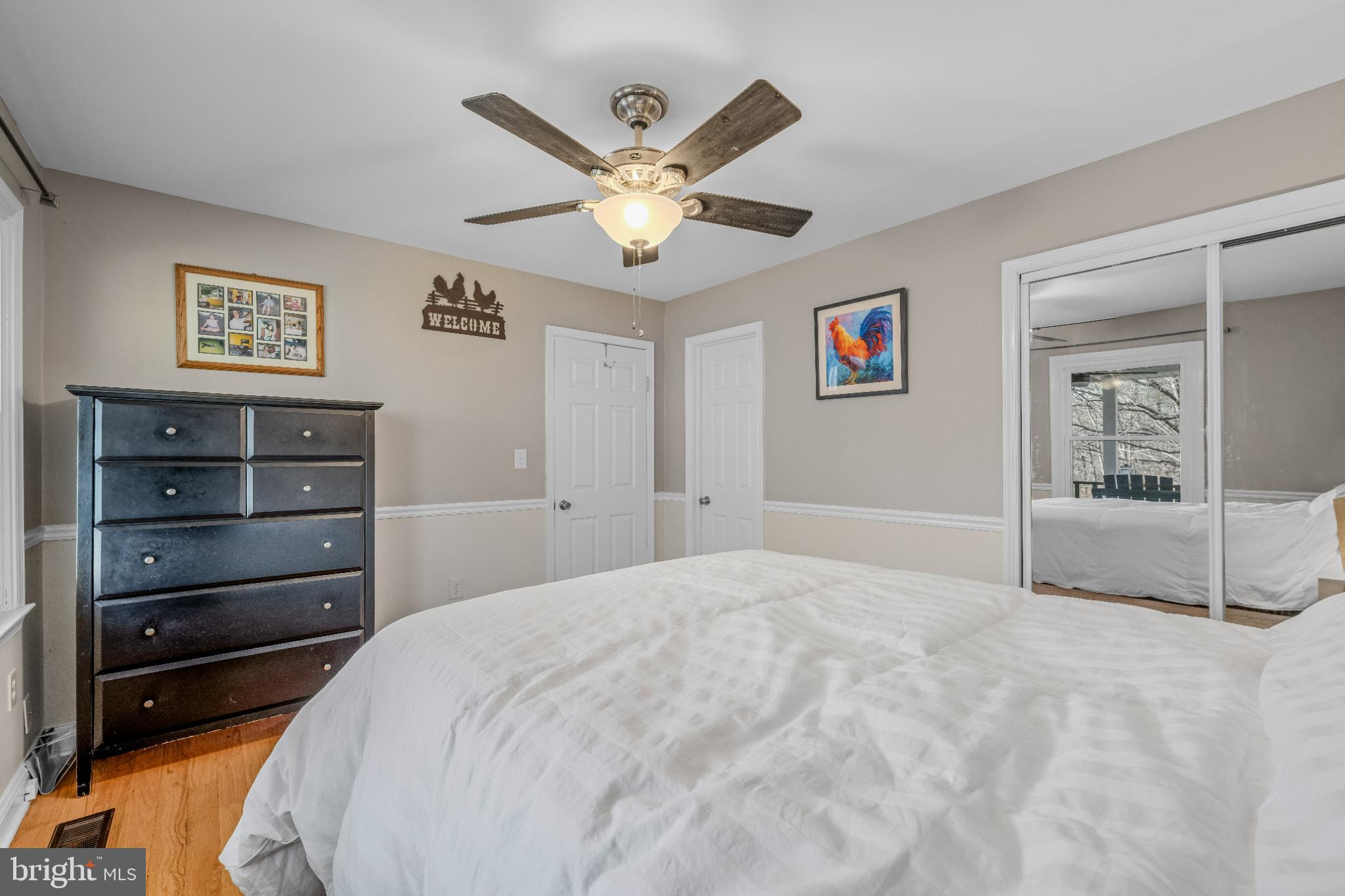 654 Soper Lane Berkeley Springs, WV 25411 - Photo 29 of 146 Inviting bedroom with natural light and charm.