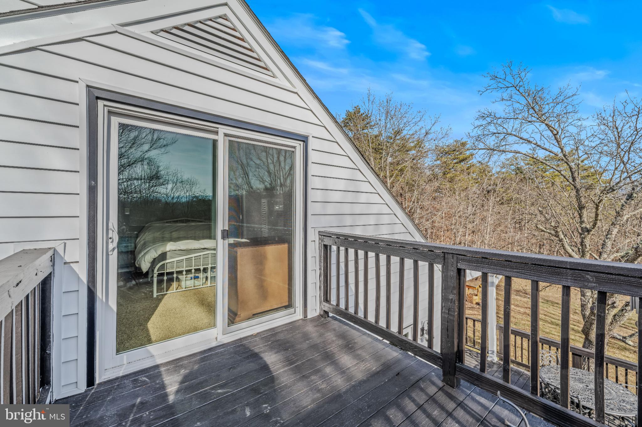 654 Soper Lane Berkeley Springs, WV 25411 - Photo 37 of 146 Charming balcony with serene woodland views.