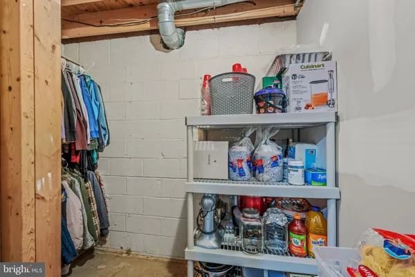 a view of a house with a yard covered in snow