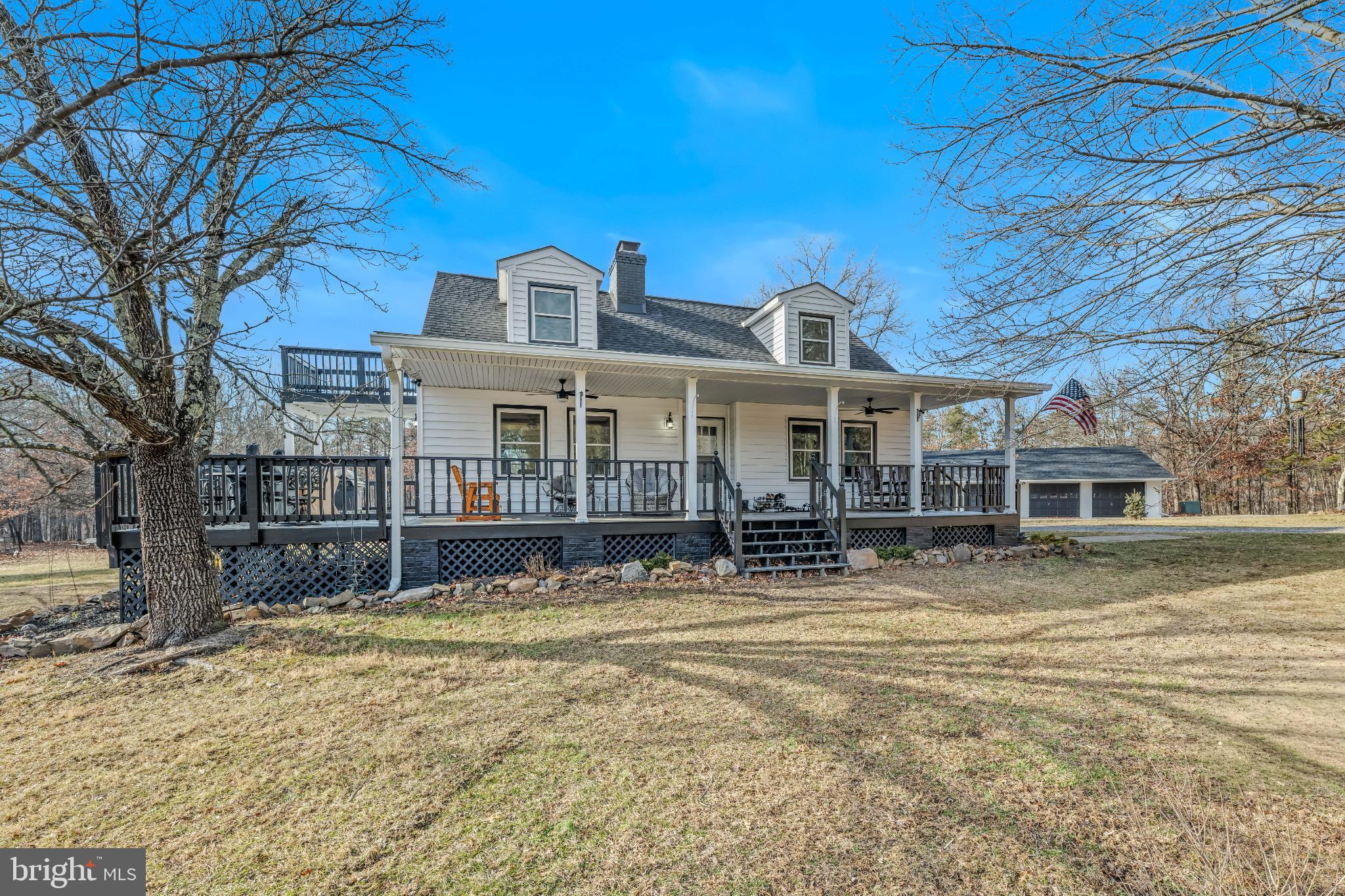 654 Soper Lane Berkeley Springs, WV 25411 - Photo 47 of 71 a front view of a house with a yard