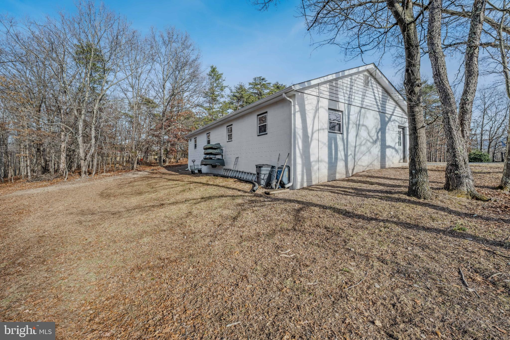 654 Soper Lane Berkeley Springs, WV 25411 - Photo 54 of 71 a view of a house with a yard covered in snow