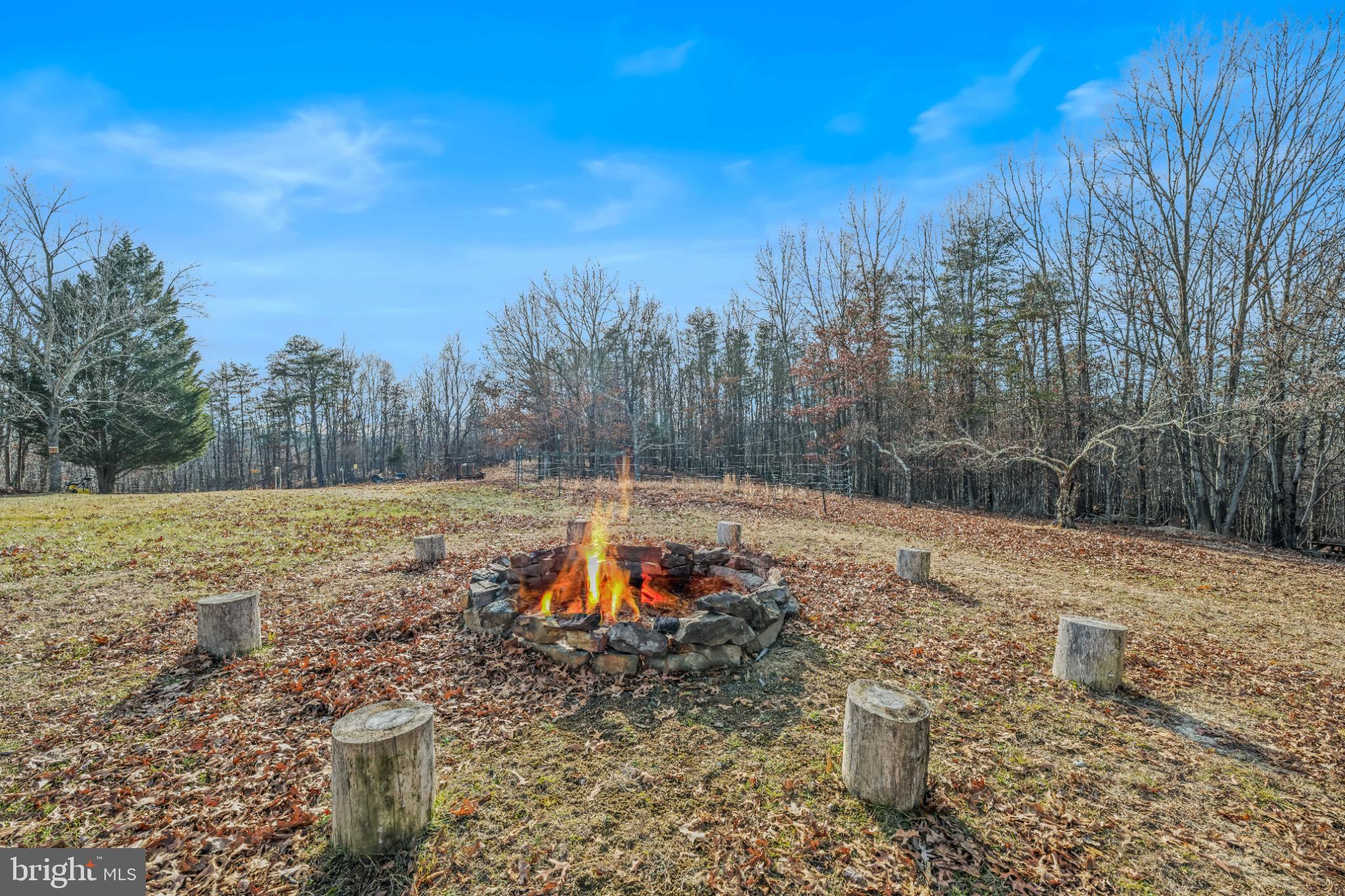 654 Soper Lane Berkeley Springs, WV 25411 - Photo 10 of 71 Cozy fire pit surrounded by nature's beauty.