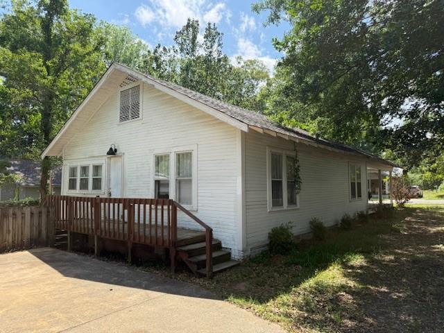 115 Goode Avenue Minden, LA 71055 - Photo 12 of 12 a view of a house with a yard deck and a garden