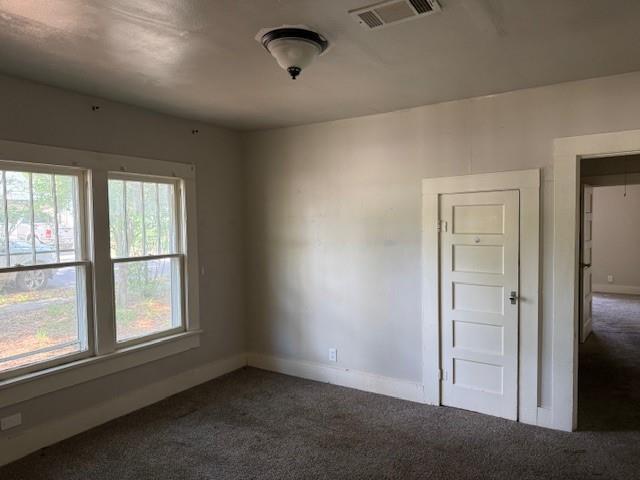 115 Goode Avenue Minden, LA 71055 - Photo 5 of 12 an empty room with windows and closet