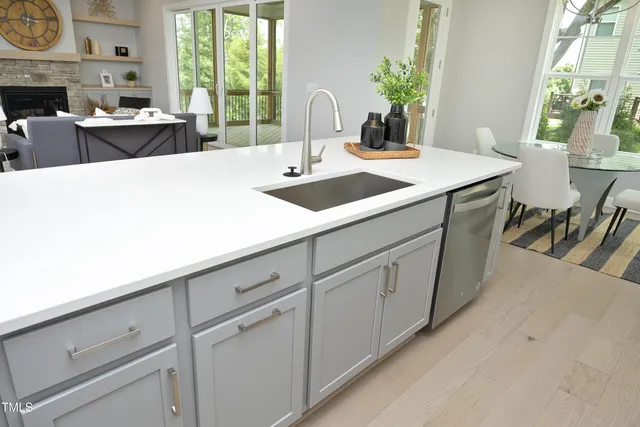 a kitchen with a sink and cabinets