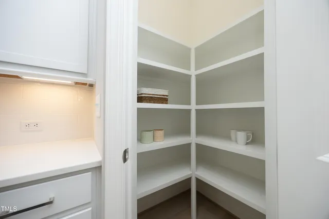 a view of an empty walk in closet
