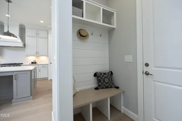a kitchen with a table and chairs in it