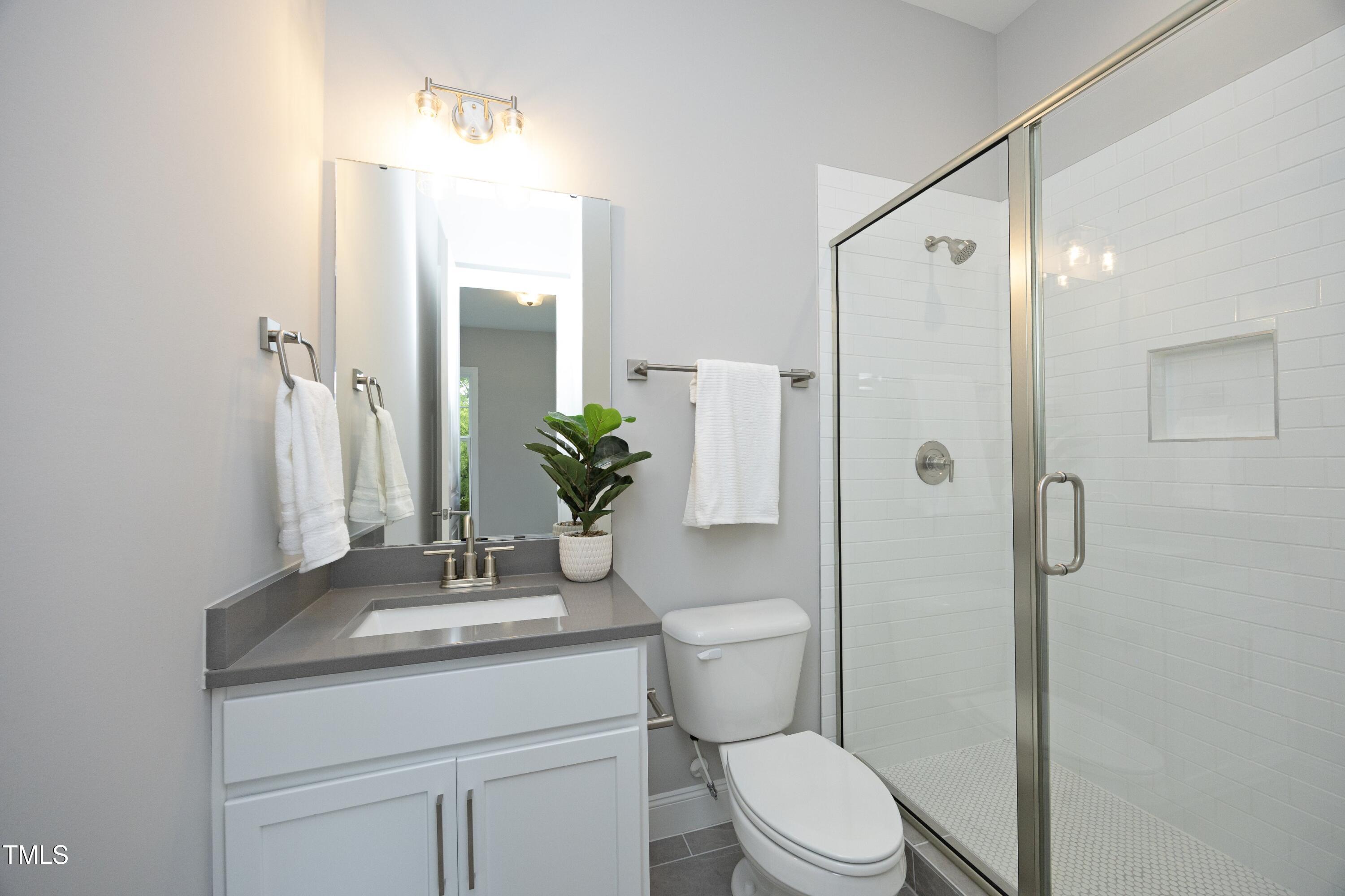 812 Willow Tower Court Rolesville, NC 27571 - Photo 22 of 43 a bathroom with a sink toilet and shower