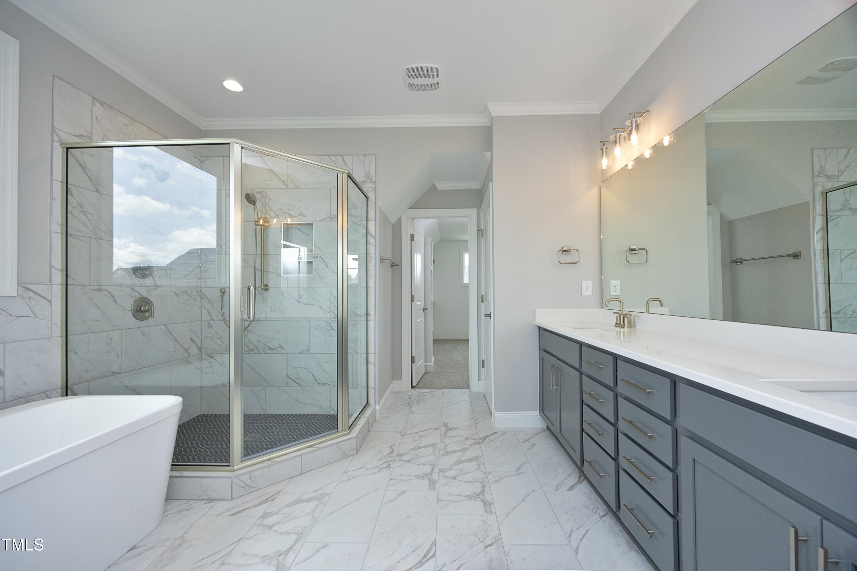 812 Willow Tower Court Rolesville, NC 27571 - Photo 26 of 43 a bathroom with a double vanity sink mirror and shower