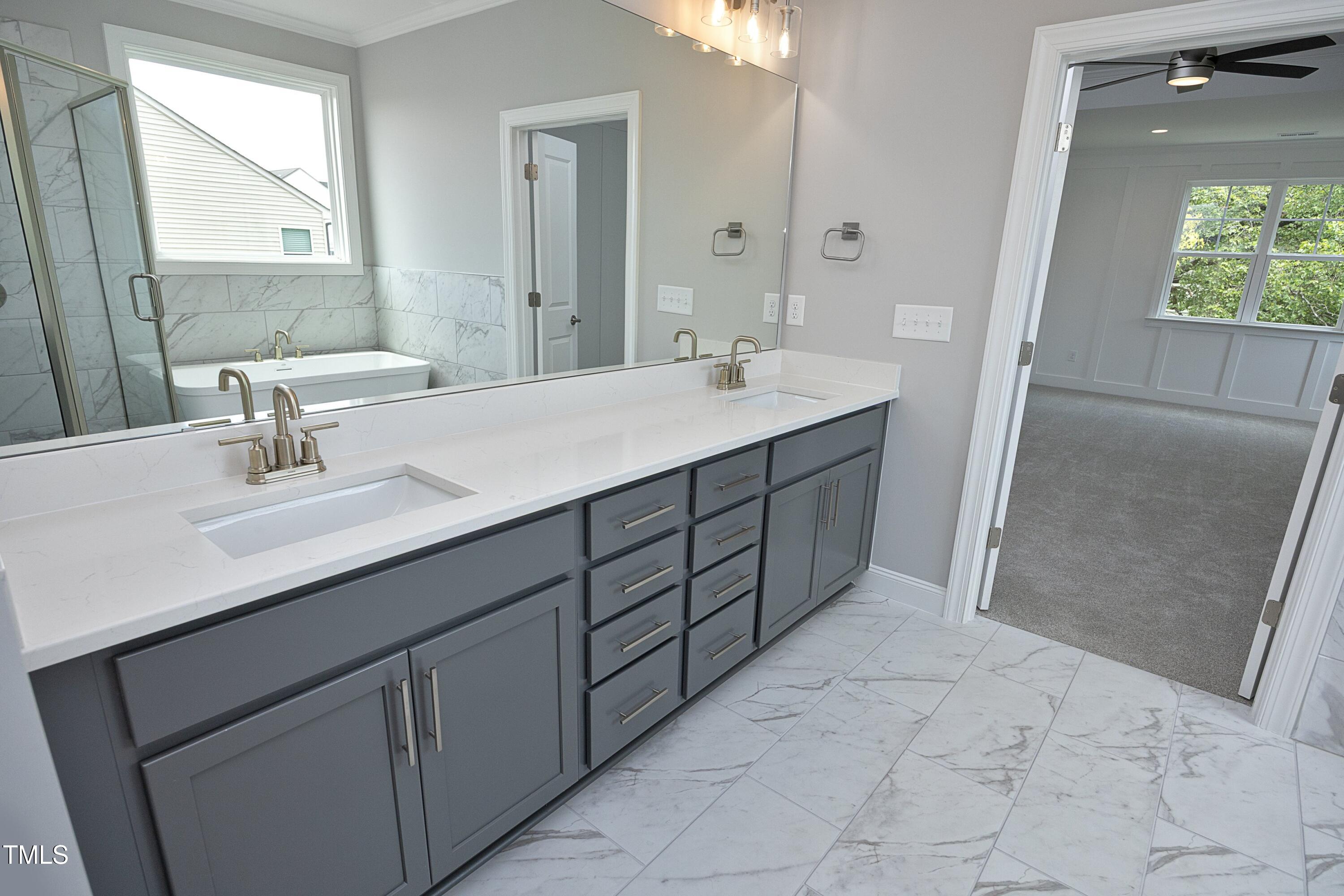 812 Willow Tower Court Rolesville, NC 27571 - Photo 30 of 43 a bathroom with a sink and a mirror