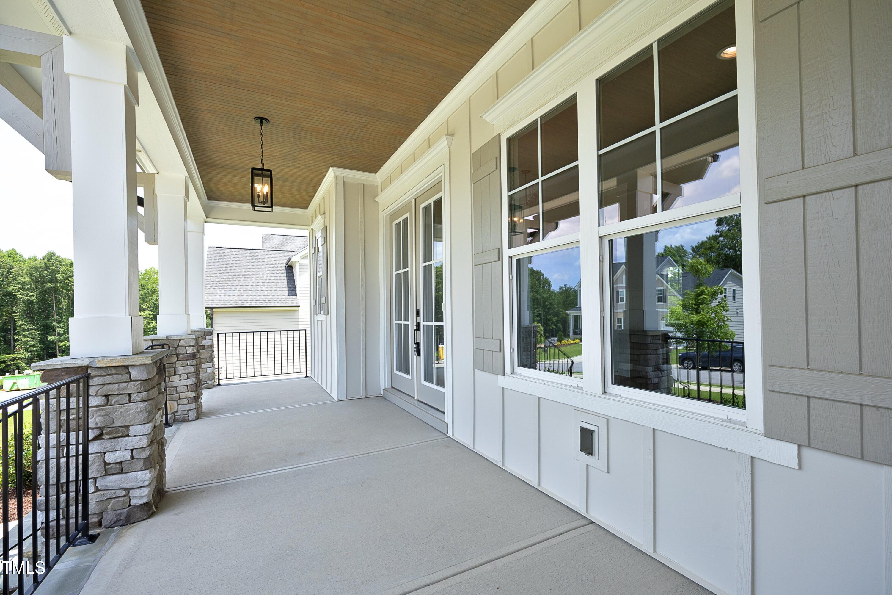 812 Willow Tower Court Rolesville, NC 27571 - Photo 3 of 43 a view of a building from a porch
