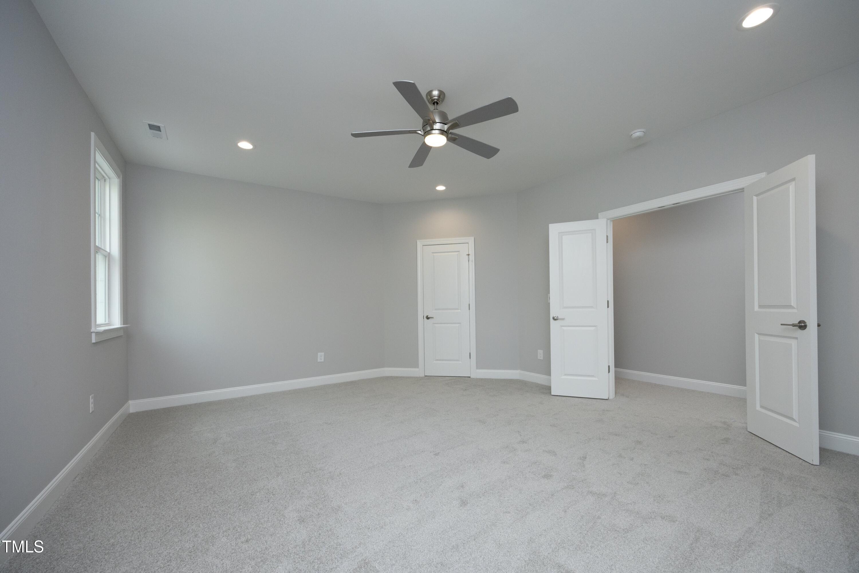 812 Willow Tower Court Rolesville, NC 27571 - Photo 32 of 43 an empty room with closet and windows
