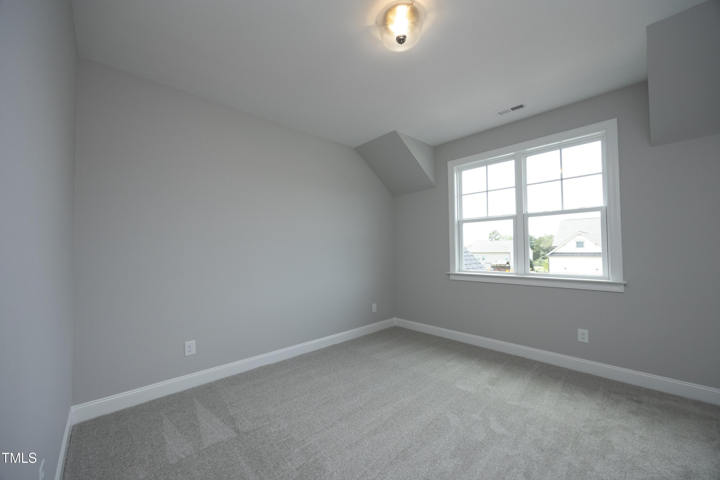 812 Willow Tower Court Rolesville, NC 27571 - Photo 33 of 43 an empty room with a window