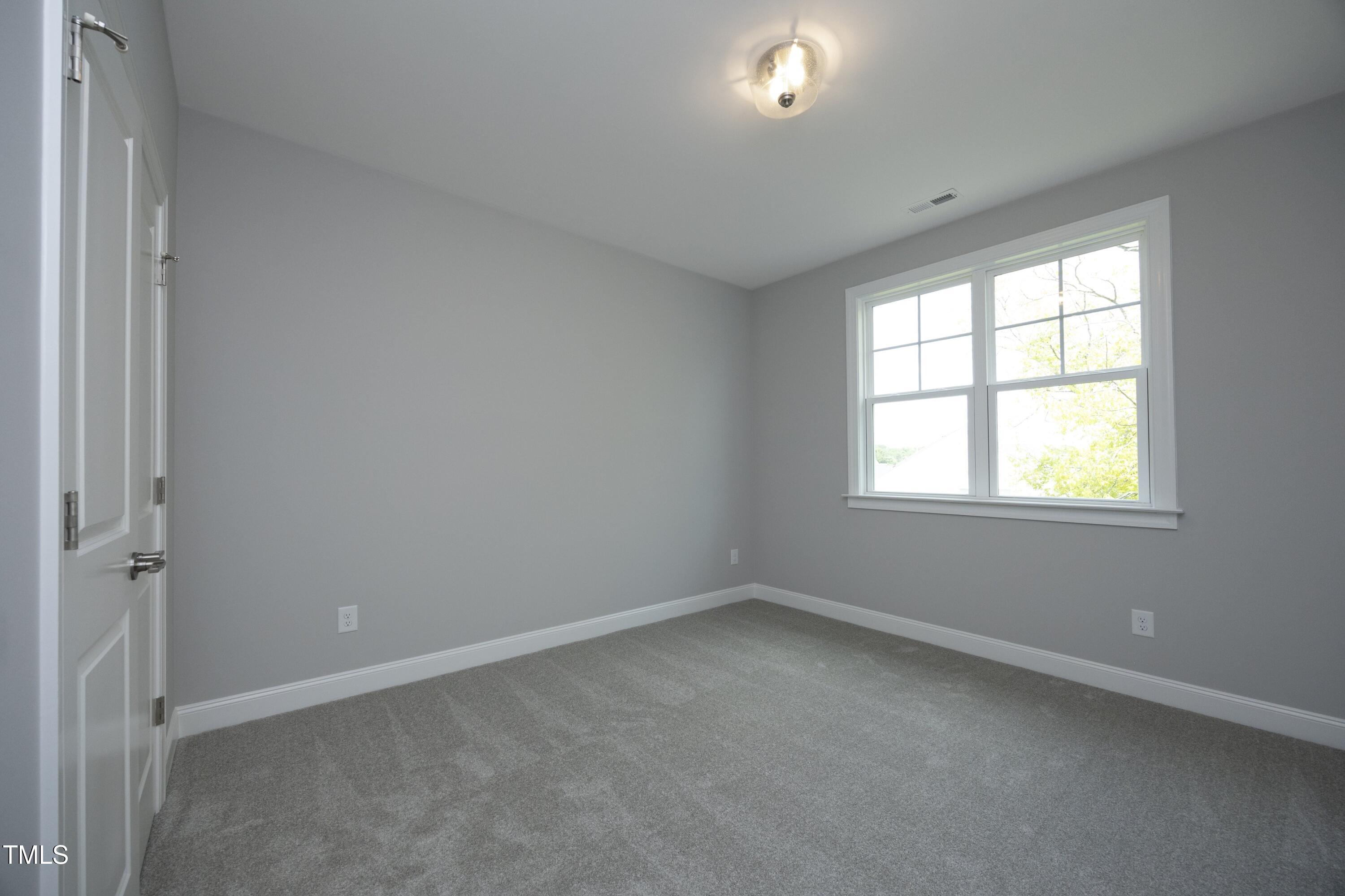 812 Willow Tower Court Rolesville, NC 27571 - Photo 34 of 43 an empty room with a window