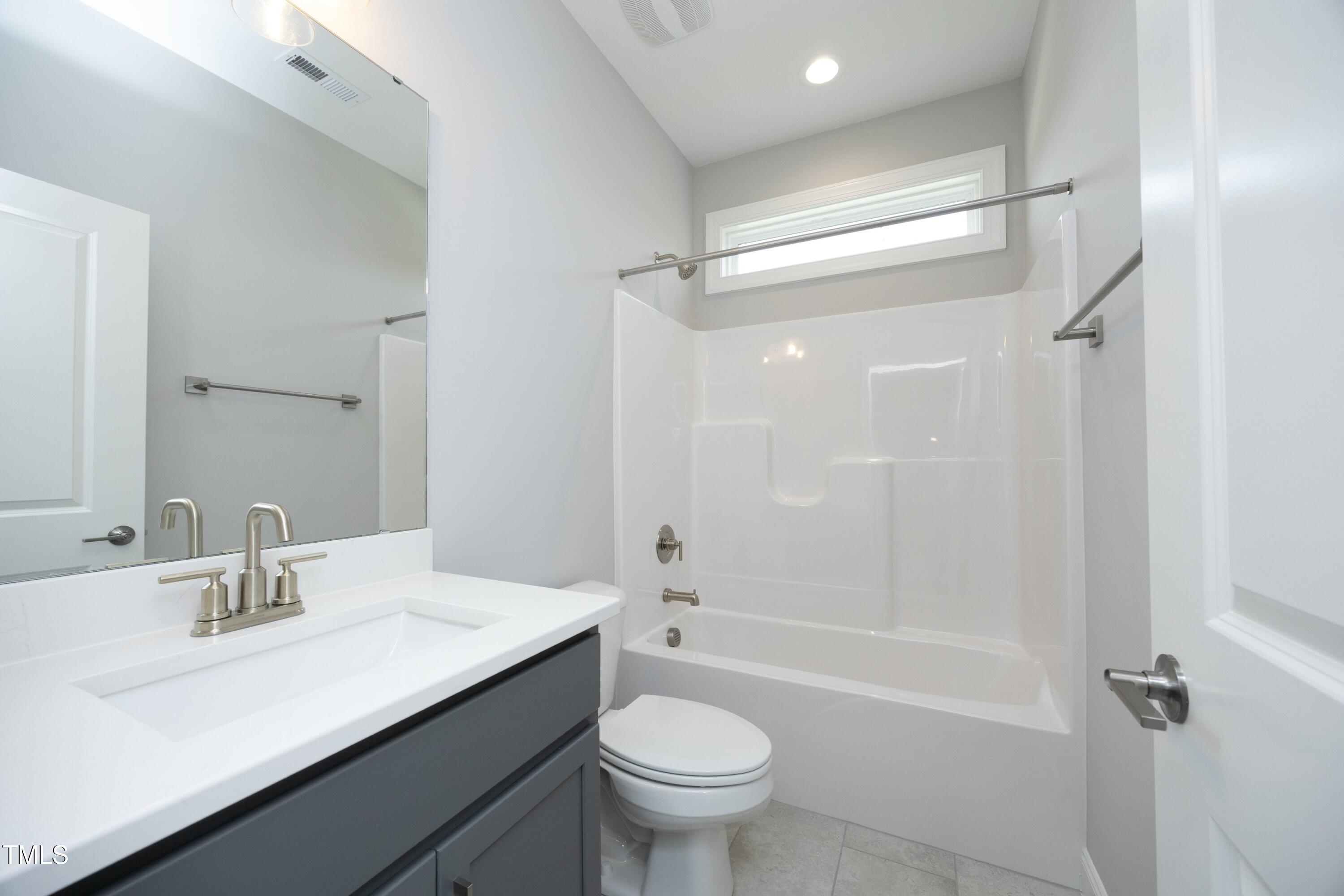 812 Willow Tower Court Rolesville, NC 27571 - Photo 35 of 43 a bathroom with a sink a toilet and shower