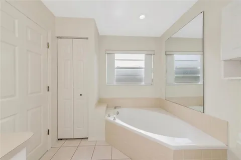 a white bath tub sitting in a bathroom