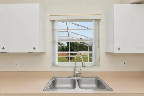 a kitchen with a sink and a window