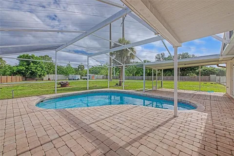 a view of a swimming pool with a backyard