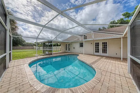 a view of a house with swimming pool