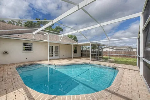 a view of a house with swimming pool