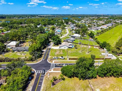 an aerial view of residential houses with outdoor space