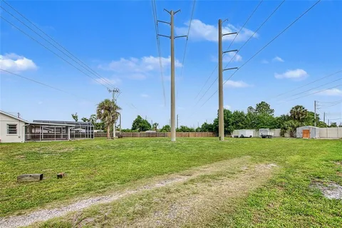 a view of a big room with a big yard and plants