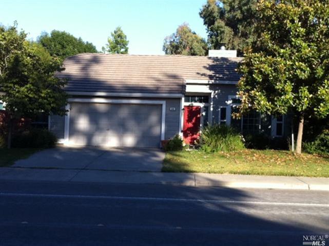 590 Evans Road Dixon, CA 95620 - Photo 1 of 1 Front of home features bright front door and beautiful Magnolia tree.