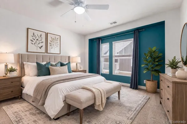 a bedroom with a bed and a dresser