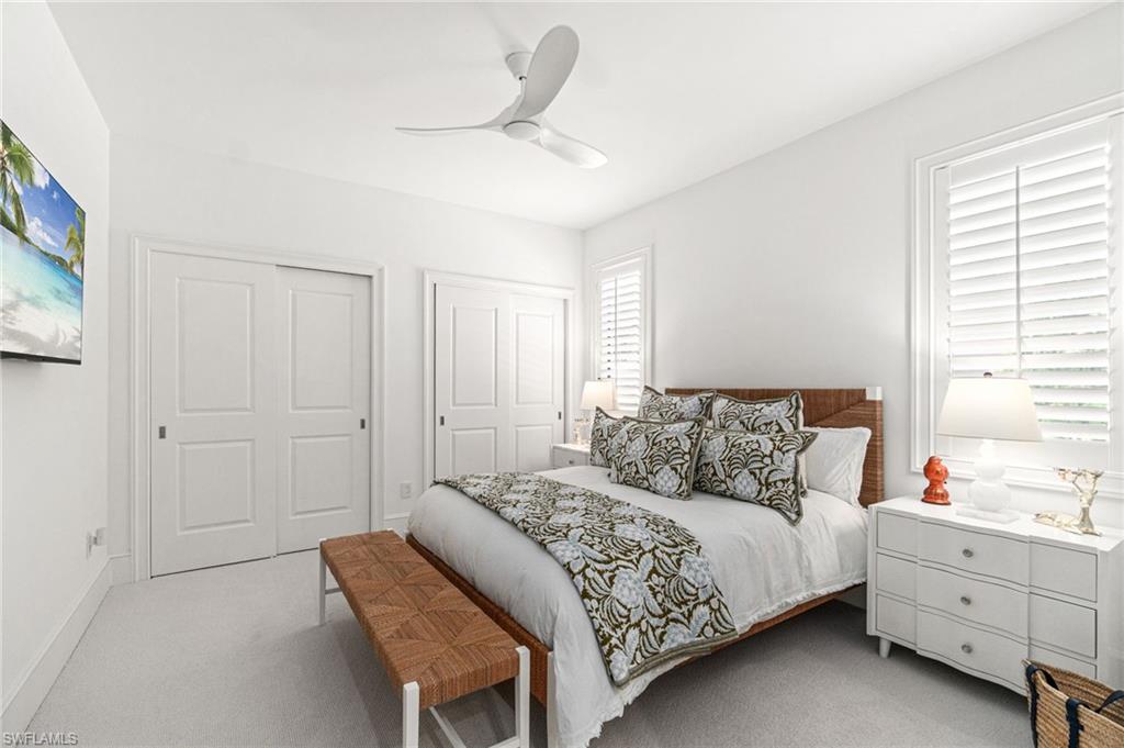 16755 Lucarno Way Naples, FL 34110 - Photo 21 of 50 a bedroom with a bed and a window