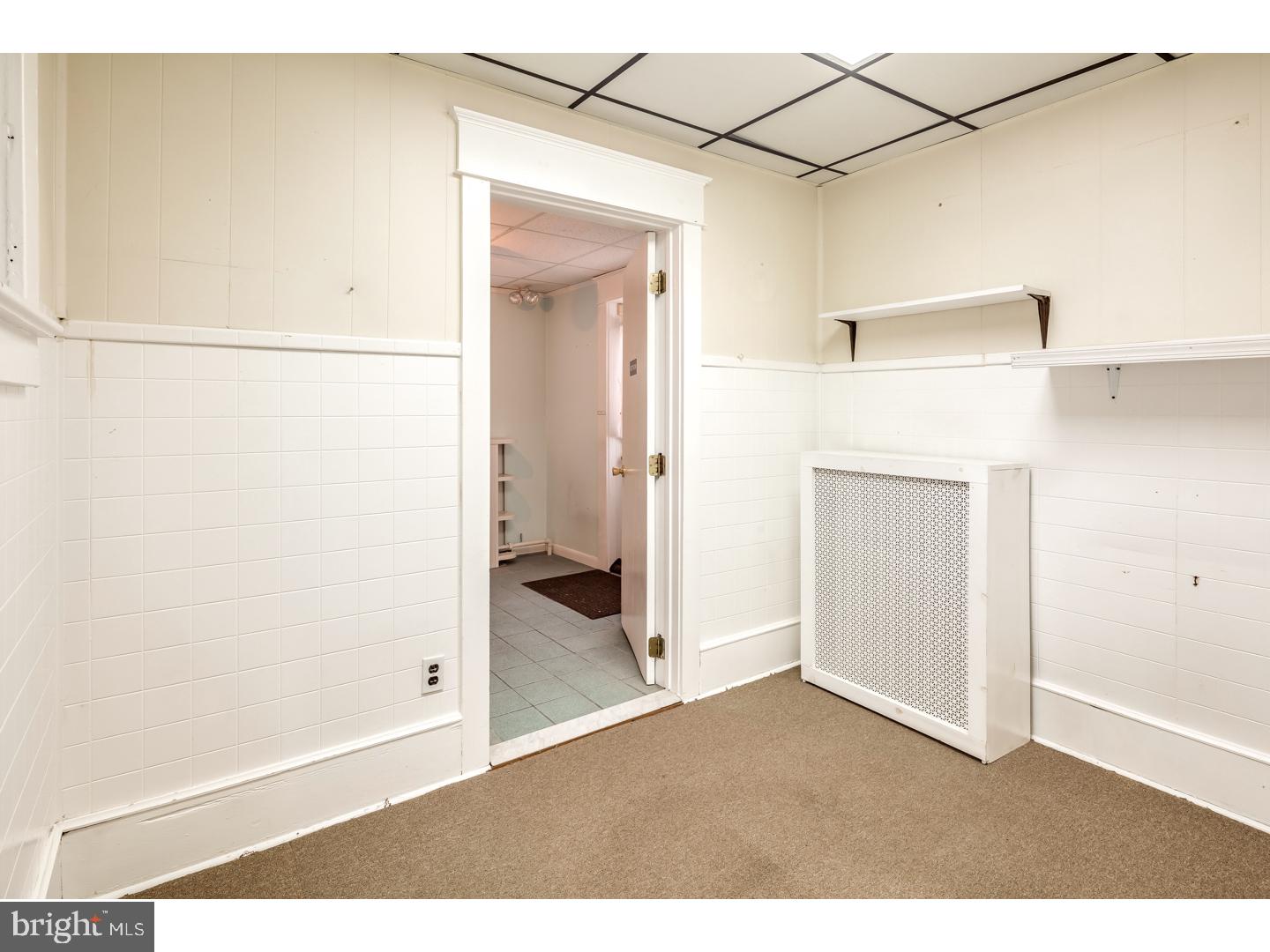 213 Clements Bridge Road Barrington, NJ 08007 - Photo 12 of 25 a view of a small space with wooden floor and cabinet