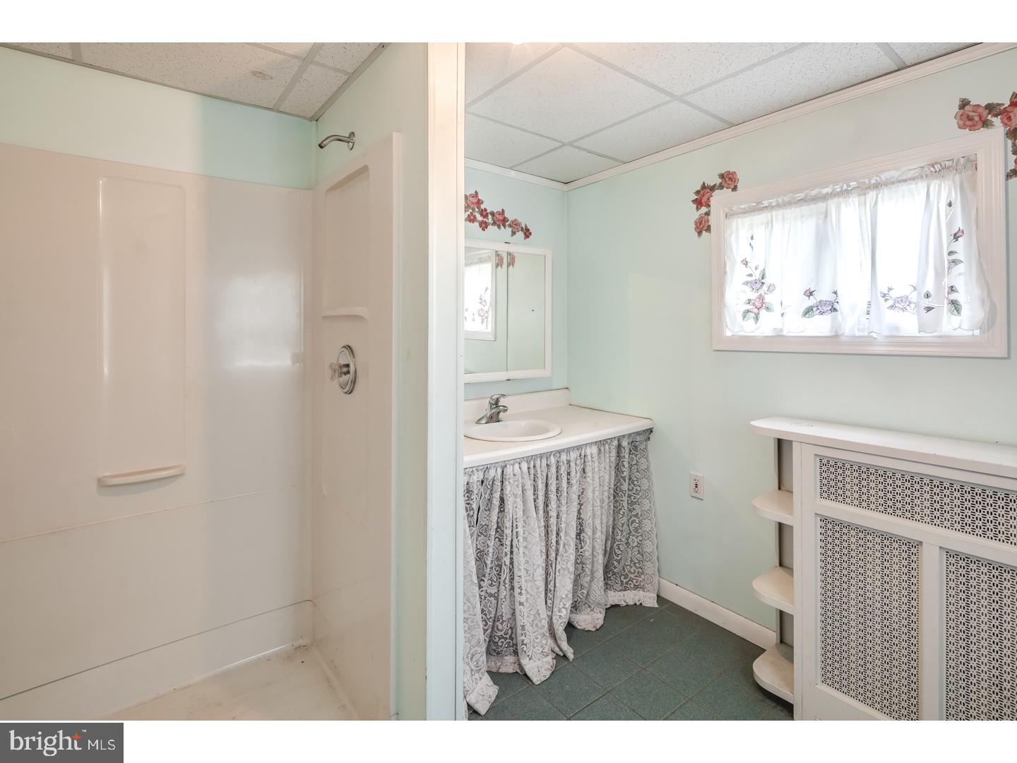 213 Clements Bridge Road Barrington, NJ 08007 - Photo 13 of 25 a bathroom with a sink a mirror and a toilet